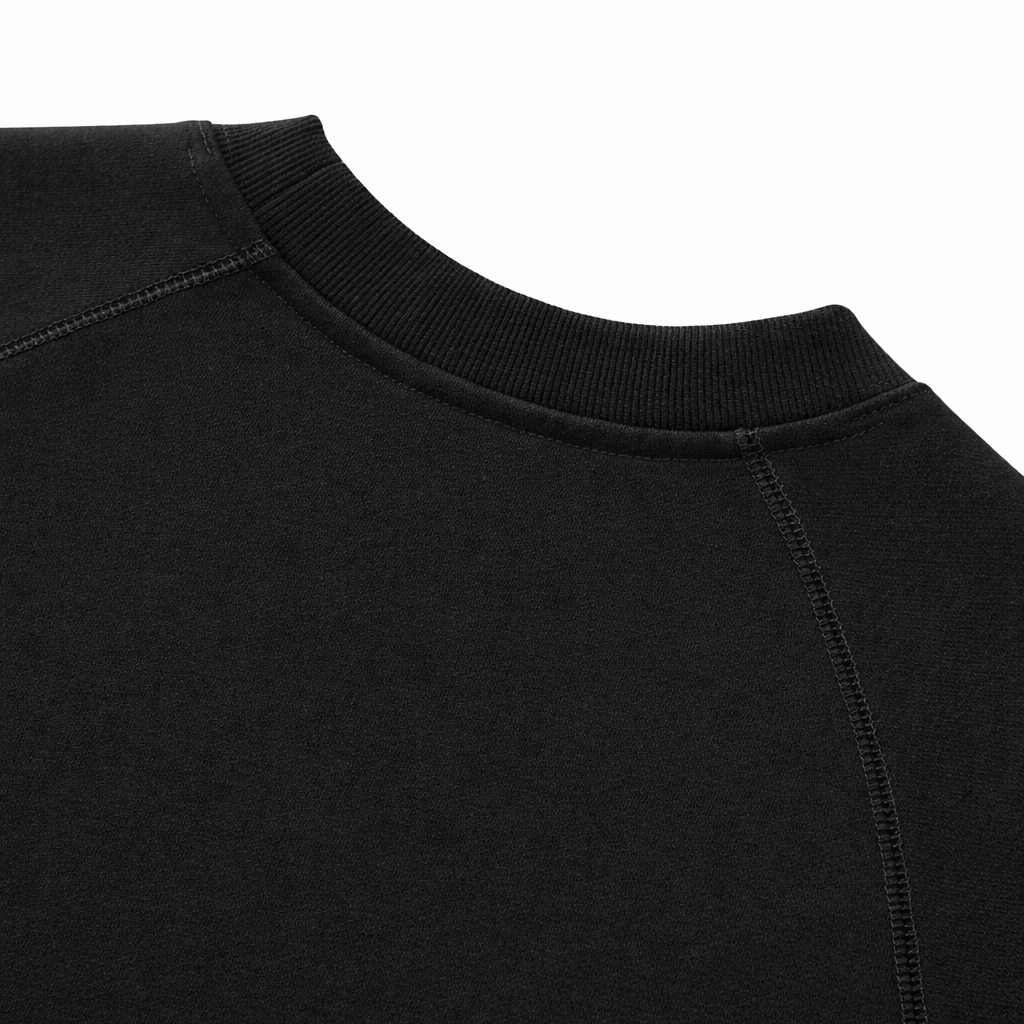 Close-up of a black sweatshirt collar on a white background